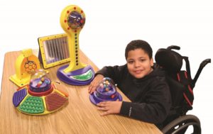 Photo of boy playing with adapted toys