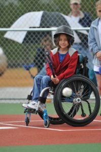 Photo of child in wheelchair at bat