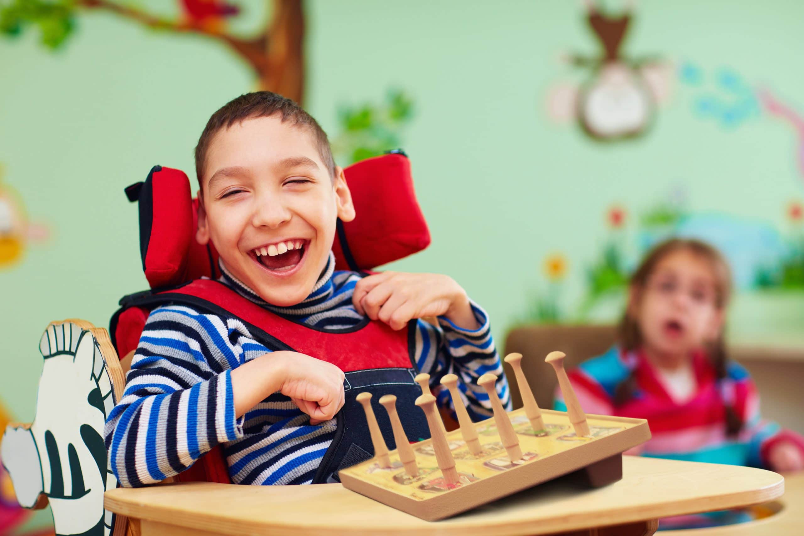 Young Boy with Cerebral Palsy Playing with a Puzzle