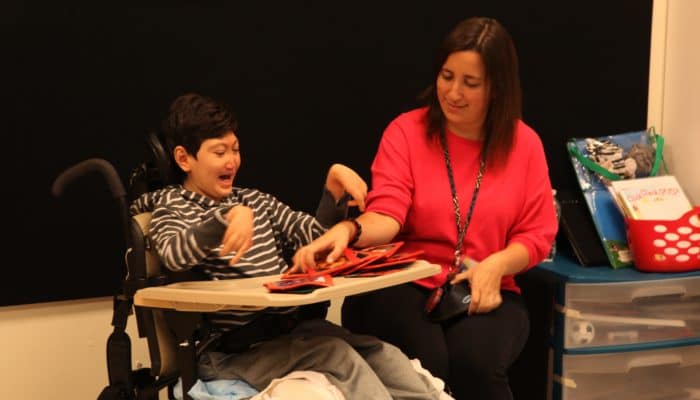 Student with Special Ed Teacher using Big Talk Triple Play during Circle Time