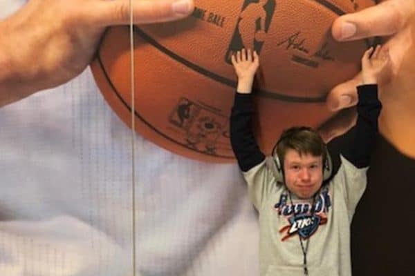 Boy in Sensory RoomWearing Noise Cancelling Headphones