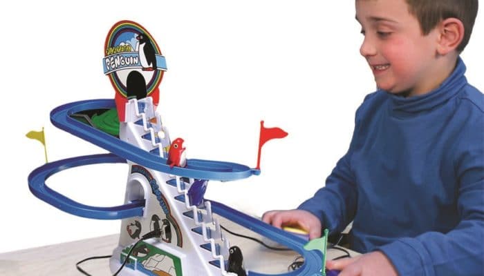 Disabled Boy Playing with Adapted Penguin Roller Coaster