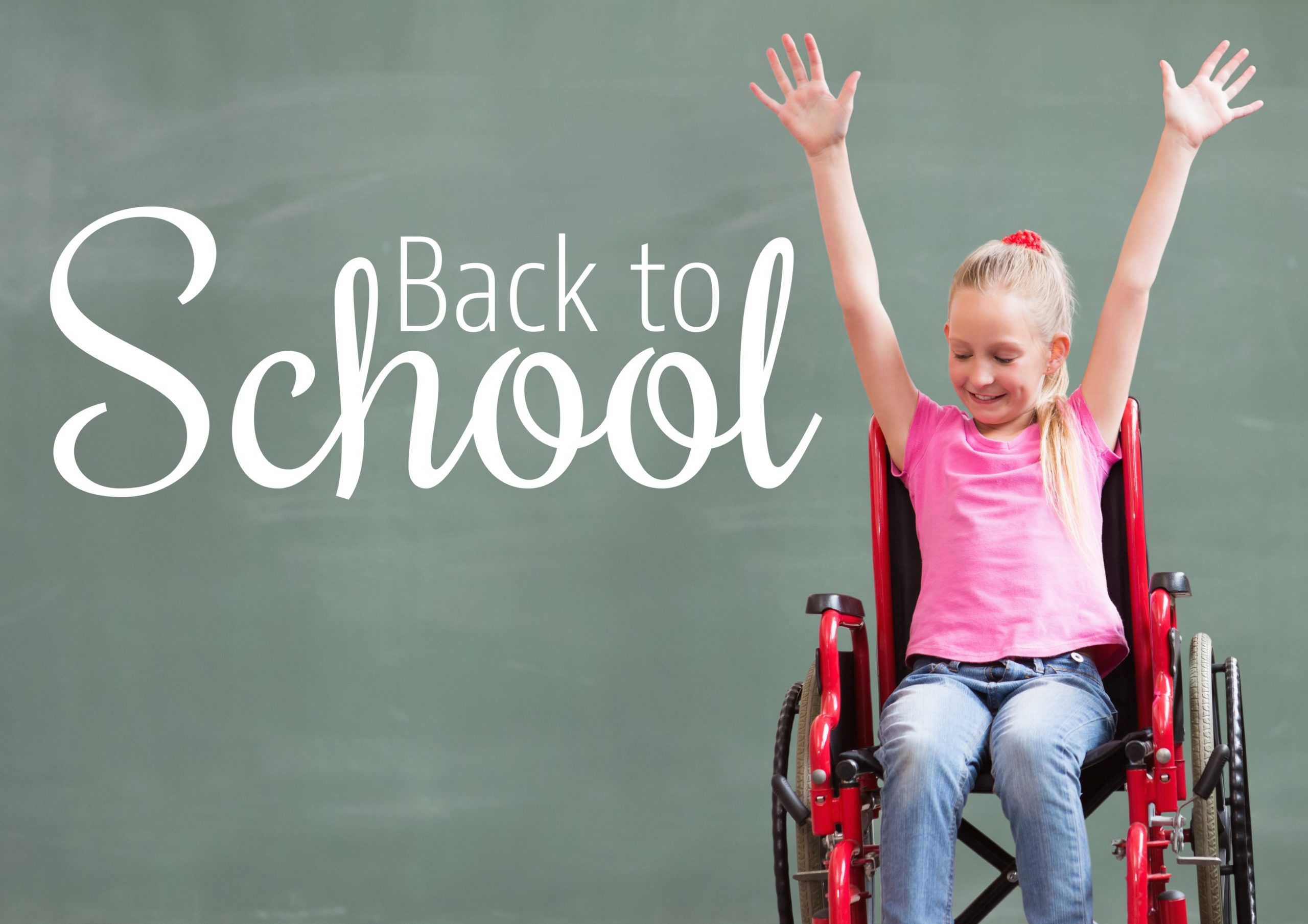 Girl in Wheelchair in front of blackboard that says "Back to School"