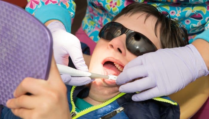 Disabled boy on dental chair